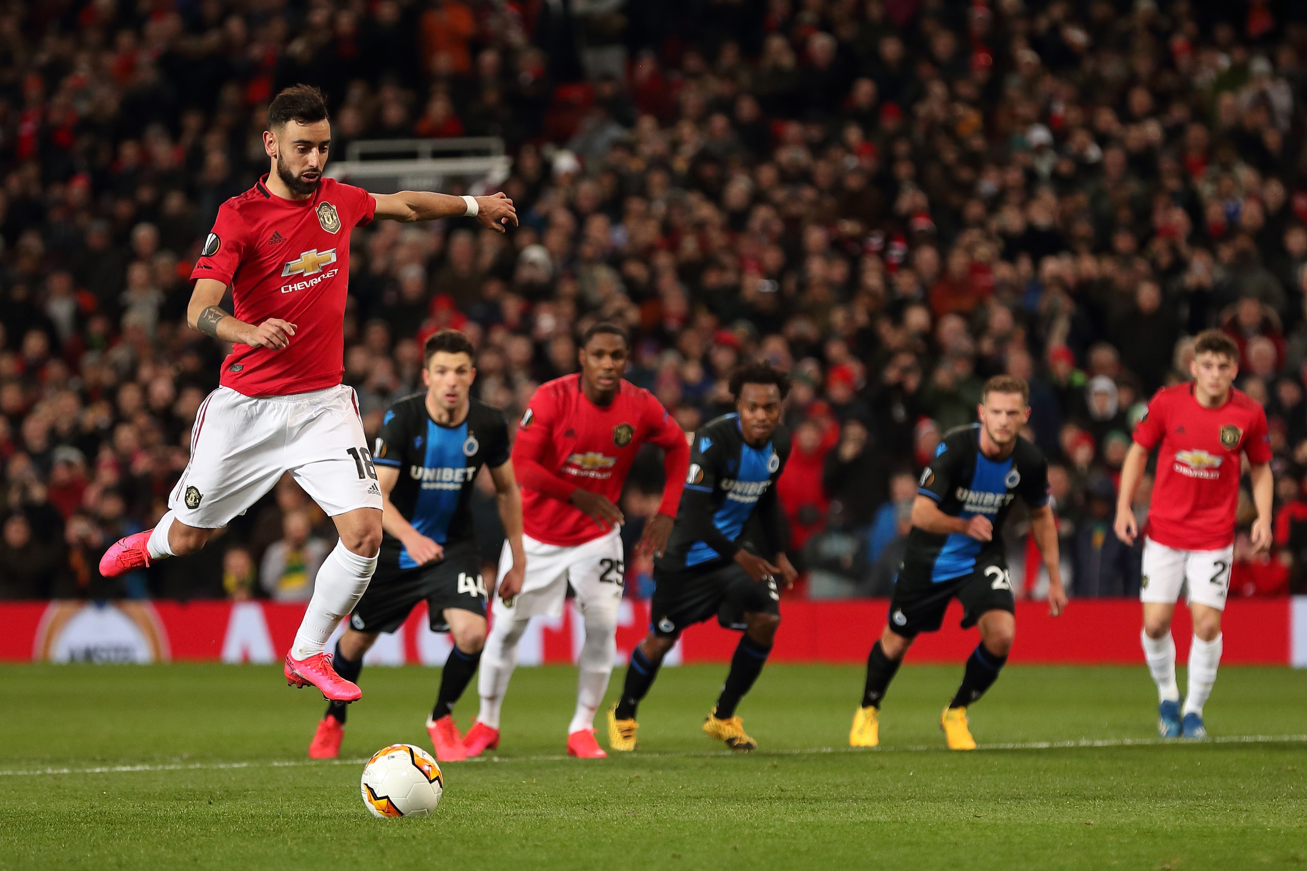 MANCHESTER, ENGLAND - FEBRUARY 27: Bruno Fernandes of Manchester United scores a penalty to make it 1-0 during the UEFA Europa League round of 32 second leg match between Manchester United and Club Brugge at Old Trafford on February 27, 2020 in Manchester, United Kingdom. (Photo by James Williamson - AMA/Getty Images)