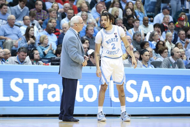 CHAPEL HILL, NC - FEBRUARY 25: Head coach Roy Williams of the University of North Carolina gives instructions to Cole Anthony #2 during a game between NC State and North Carolina at Dean E. Smith Center on February 25, 2020 in Chapel Hill, North Carolina. (Photo by Andy Mead/ISI Photos/Getty Images)