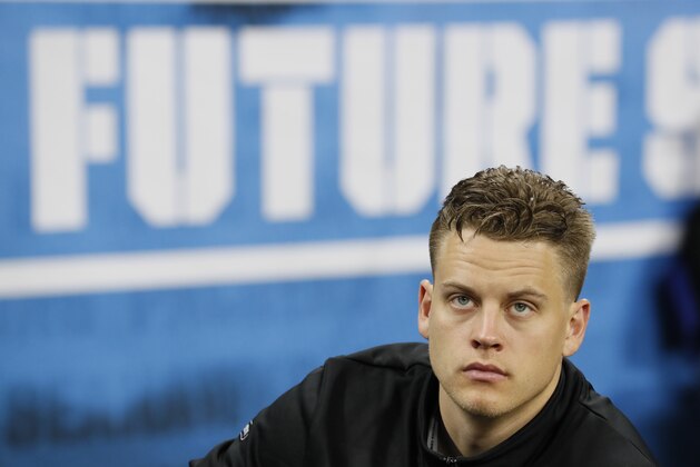 LSU quarterback Joe Burrow watches a drill at the NFL football scouting combine in Indianapolis, Thursday, Feb. 27, 2020. (AP Photo/Charlie Neibergall)