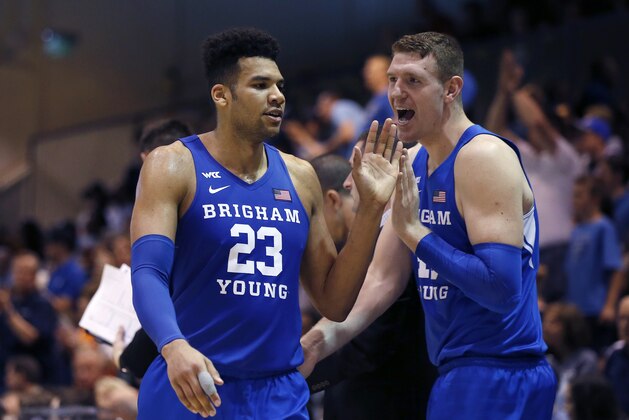 BYU forward Yoeli Childs (23) is greeted by Kolby Lee as he walks off the court during the second half of the team's NCAA college basketball game against Pepperdine on Saturday, Feb. 29, 2020, in Malibu, Calif. (AP Photo/Ringo H.W. Chiu) BYU forward Yoeli Childs (23) is greeted by Kolby Lee as he walks off the court during the second half of the team's NCAA college basketball game against Pepperdine on Saturday, Feb. 29, 2020, in Malibu, Calif. (AP Photo/Ringo H.W. Chiu)