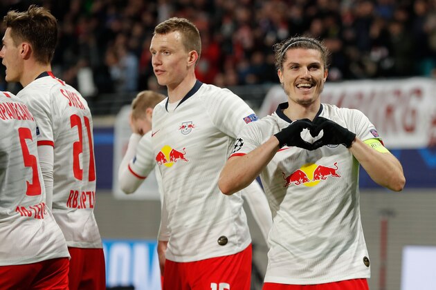 Leipzig's Austrian midfielder Marcel Sabitzer (R) celebrates scoring the 2-0 goal with his teammates during the UEFA Champions League football match between RB Leipzig and Tottenham Hotspur, in Leipzig, eastern Germany on March 10, 2020. (Photo by Odd ANDERSEN / AFP) (Photo by ODD ANDERSEN/AFP via Getty Images)