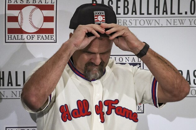 Colorado Rockies outfielder Larry Walker put his cap on during Baseball Hall of Fame press conference, Wednesday Jan. 22, 2020, conference in New York. Walker and New York Yankees shortstop Derek Jeter will both join the 2020 Hall of Fame class. (AP Photo/Bebeto Matthews)