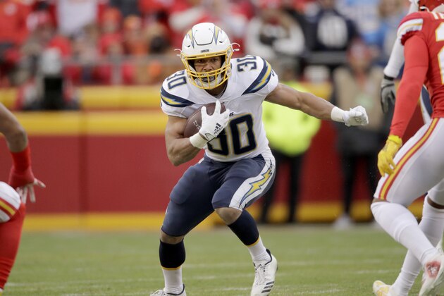 Los Angeles Chargers running back Austin Ekeler (30) carries the ball during the first half of an NFL football game against the Kansas City Chiefs in Kansas City, Mo., Sunday, Dec. 29, 2019. (AP Photo/Charlie Riedel)