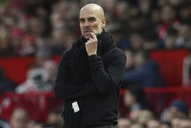 Manchester City's head coach Pep Guardiola reacts during the English Premier League soccer match between Manchester United and Manchester City at Old Trafford in Manchester, England, Sunday, March 8, 2020. (AP Photo/Dave Thompson) Manchester City's head coach Pep Guardiola reacts during the English Premier League soccer match between Manchester United and Manchester City at Old Trafford in Manchester, England, Sunday, March 8, 2020. (AP Photo/Dave Thompson)