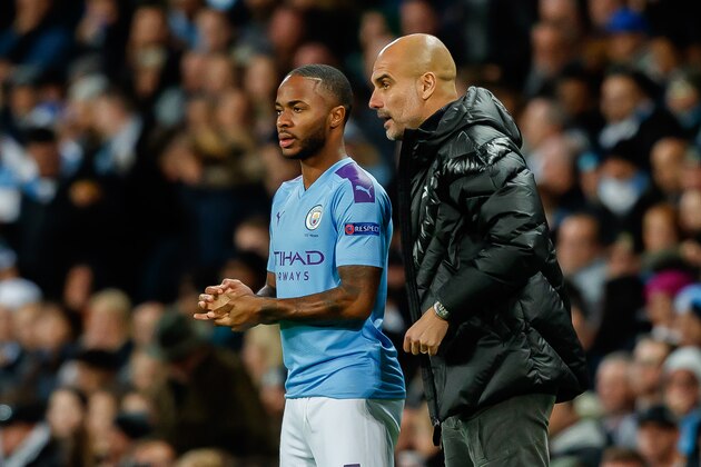 MANCHESTER, ENGLAND - OCTOBER 01: Raheem Sterling of FC Manchester City, head coach Josep Guardiola of FC Manchester City speaks with during the UEFA Champions League group C match between Manchester City and Dinamo Zagreb at Etihad Stadium on October 1, 2019 in Manchester, United Kingdom. (Photo by TF-Images/Getty Images)