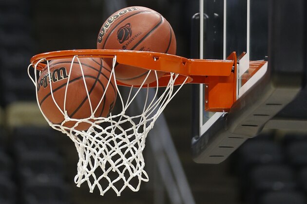 Basketballs go through the hoop as teams  go through drills during practice for an NCAA college basketball second round game in Pittsburgh Wednesday, March 18, 2015. (AP Photo/Keith Srakocic)