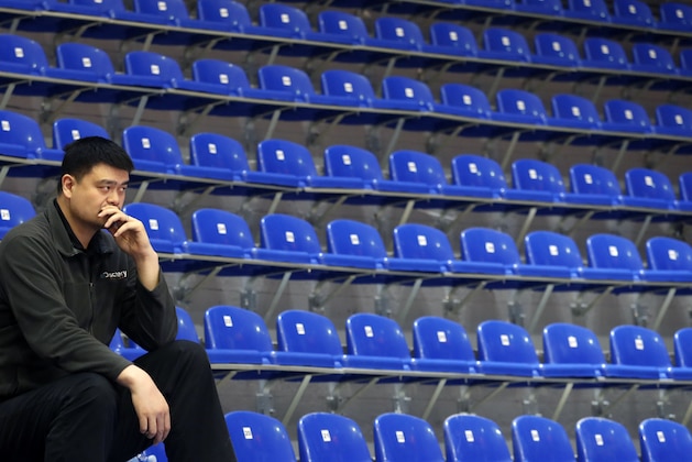 Yao Ming, head of the Chinese Basketball Association and former NBA player looks on during warm up before the Women's Olympic Qualifying Tournaments match between Korea and China in Belgrade, Serbia, Sunday, Feb. 9, 2020. (AP Photo/Darko Vojinovic)