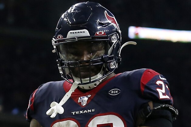 HOUSTON, TEXAS - JANUARY 04: Running back Carlos Hyde #23 of the Houston Texans celebrates after a touchdown in the fourth quarter of the AFC Wild Card Playoff game against the Buffalo Bills at NRG Stadium on January 04, 2020 in Houston, Texas. (Photo by Tim Warner/Getty Images)