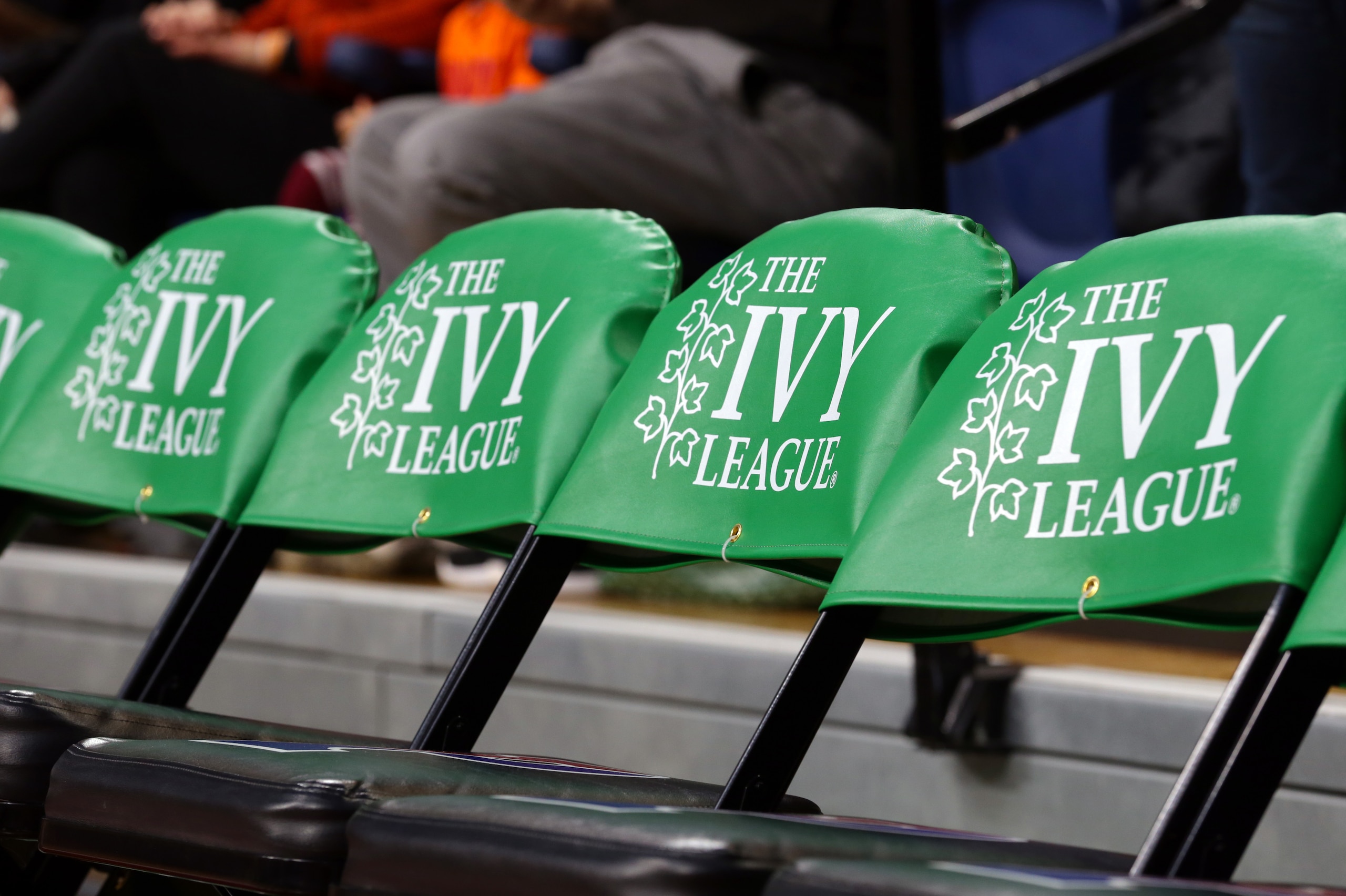 PHILADELPHIA, PA - MARCH 11: The Ivy League logo is displayed on chairs on the players bench during a game between the Princeton Tigers and the Pennsylvania Quakers at The Palestra during the semifinals of the Ivy League Basketball Tournament on March 11, 2017 in Philadelphia, Pennsylvania. Princeton won 72-64 in overtime. (Photo by Hunter Martin/Getty Images)