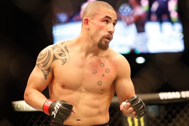 Robert Whittaker of Australia in action against Israel Adesanya of New Zealand  during the middleweight title bout of the UFC 243 fight night in Melbourne on October 6, 2019. (Photo by ASANKA BRENDON RATNAYAKE / AFP) / -- IMAGE RESTRICTED TO EDITORIAL USE - STRICTLY NO COMMERCIAL USE -- (Photo by ASANKA BRENDON RATNAYAKE/AFP via Getty Images)