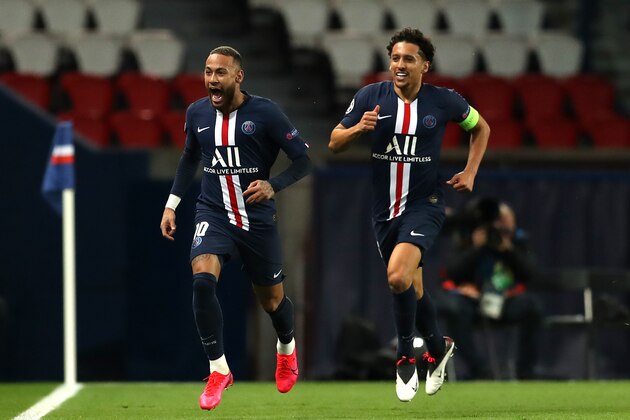 PARIS, FRANCE - MARCH 11: (FREE FOR EDITORIAL USE) In this handout image provided by UEFA, Neymar of Paris Saint-Germain celebrates with Marquinhos after scoring his team's first goal during the UEFA Champions League round of 16 second leg match between Paris Saint-Germain and Borussia Dortmund at Parc des Princes on March 11, 2020 in Paris, France. The match is played behind closed doors as a precaution against the spread of COVID-19 (Coronavirus).  (Photo by UEFA - Handout/UEFA via Getty Images)