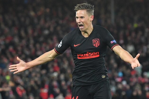 Atletico Madrid's Spanish midfielder Marcos Llorente celebrates scoring his team's second goal during the UEFA Champions league Round of 16 second leg football match between Liverpool and Atletico Madrid at Anfield in Liverpool, north west England on March 11, 2020. (Photo by Paul ELLIS / AFP) (Photo by PAUL ELLIS/AFP via Getty Images)