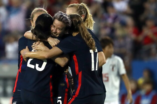FRISCO, TEXAS - MARCH 11:  Megan Rapinoe #15 of the United States celebrates a goal by Christen Press #23 against Japan during the first half of the 2020 SheBelieves Cup at Toyota Stadium on March 11, 2020 in Frisco, Texas. (Photo by Ronald Martinez/Getty Images)