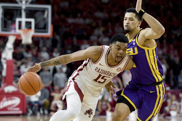 FILE - In this March 4, 2020, file photo, Arkansas guard Mason JonesÂ (15) drives against LSU defender Skylar Mays (4) during the first half of an NCAA college basketball game in Fayetteville, Ark. Jones was selected to the Associated Press All-SEC first team announced Tuesday, March 10, 2020. Jones also tied for AP SEC Player of the Year. (AP Photo/Michael Woods, File)