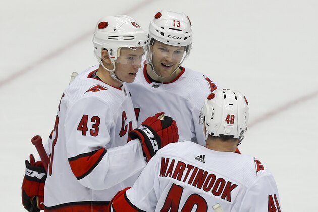 Carolina Hurricanes' Morgan Geekie (43) celebrates with Warren Foegele (13) and Jordan Martinook (48) after scoring his second goal of the game during the third period of an NHL hockey game against the Pittsburgh Penguins, Sunday, March 8, 2020, in Pittsburgh. The Hurricanes won 6-2. (AP Photo/Keith Srakocic) Carolina Hurricanes' Morgan Geekie (43) celebrates with Warren Foegele (13) and Jordan Martinook (48) after scoring his second goal of the game during the third period of an NHL hockey game against the Pittsburgh Penguins, Sunday, March 8, 2020, in Pittsburgh. The Hurricanes won 6-2. (AP Photo/Keith Srakocic)