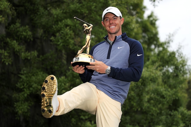 PONTE VEDRA BEACH, FLORIDA - MARCH 17:  Rory McIlroy of Northern Ireland shows how the sole of his shoes matches the winner's trophy after winning The PLAYERS Championship on The Stadium Course at TPC Sawgrass on March 17, 2019 in Ponte Vedra Beach, Florida. (Photo by Mike Ehrmann/Getty Images)