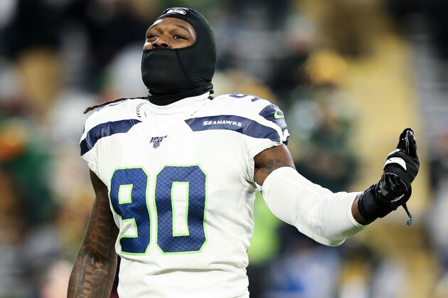 GREEN BAY, WISCONSIN - JANUARY 12: Jadeveon Clowney #90 of the Seattle Seahawks warms up before the NFC Divisional Round Playoff game against the Green Bay Packers at Lambeau Field on January 12, 2020 in Green Bay, Wisconsin. (Photo by Dylan Buell/Getty Images)