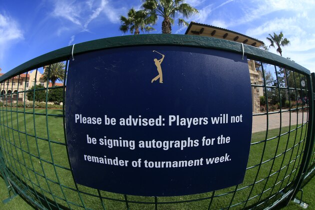 PONTE VEDRA BEACH, FLORIDA - MARCH 12: Signs inform fans that the autograph section has been closed for the rest of the week during the first round of The PLAYERS Championship on The Stadium Course at TPC Sawgrass on March 12, 2020 in Ponte Vedra Beach, Florida. (Photo by Cliff Hawkins/Getty Images)