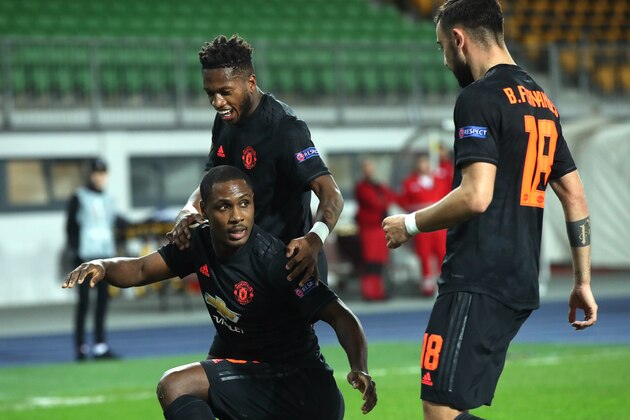 LINZ, AUSTRIA - MARCH 12: (FREE FOR EDITORIAL USE) In this handout image provided by UEFA, Odion Ighalo of Manchester United celebrates with Fred and Bruno Fernandes after scoring his team's first goal during the UEFA Europa League round of 16 first leg match between LASK and Manchester United at Linzer Stadion on March 12, 2020 in Linz, Austria. The match is played behind closed doors as a precaution against the spread of COVID-19 (Coronavirus).  (Photo by UEFA - Handout/UEFA via Getty Images )