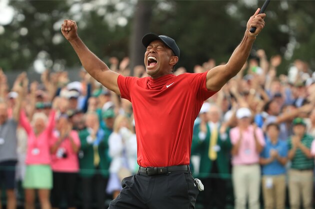 AUGUSTA, GEORGIA - APRIL 14: Tiger Woods (L) of the United States celebrates on the 18th green after winning the Masters at Augusta National Golf Club on April 14, 2019 in Augusta, Georgia. (Photo by Andrew Redington/Getty Images)