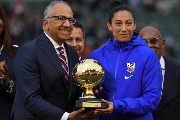 CARSON, CA - FEBRUARY 09: Christen Press #20 of the United States receives the Scotiabank Golden Ball Award from Carlos Cordeiro, president of US Soccer, after the CONCACAF Women's Olympic Qualifying Final at Dignity Health Sports Park against  Canada on February 9, 2020 in Carson, California. (Photo by Jayne Kamin-Oncea/Getty Images)