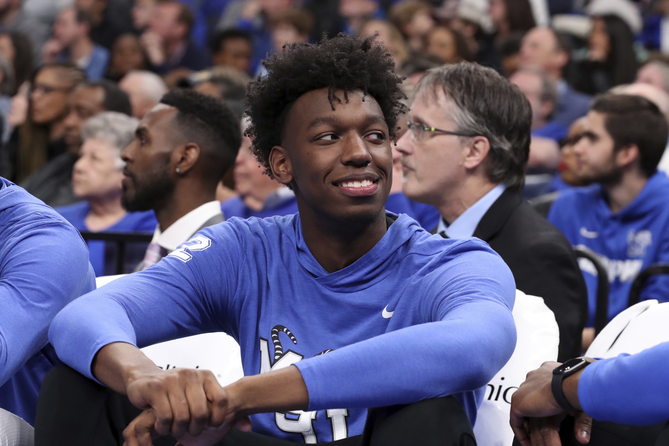 Memphis' James Wiseman watches the game from the bench in the second half of an NCAA college basketball game against Ole Miss Saturday, Nov. 23, 2019, in Memphis, Tenn. (AP Photo/Karen Pulfer Focht)