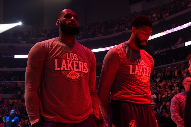 LOS ANGELES, CA - MARCH 10: LeBron James #23, and Anthony Davis #3 of the Los Angeles Lakers stands for the National Anthem before the game against the Brooklyn Nets on March 10, 2020 at STAPLES Center in Los Angeles, California. NOTE TO USER: User expressly acknowledges and agrees that, by downloading and/or using this Photograph, user is consenting to the terms and conditions of the Getty Images License Agreement. Mandatory Copyright Notice: Copyright 2020 NBAE (Photo by Andrew D. Bernstein/NBAE via Getty Images)
