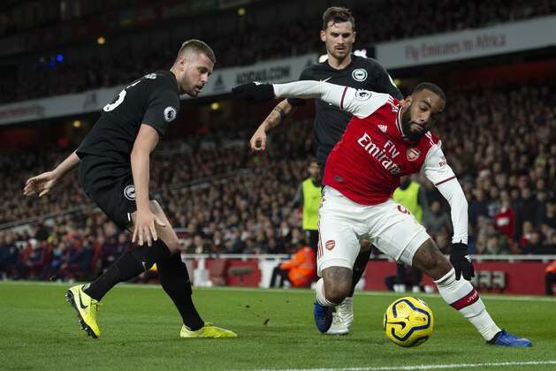 LONDON, ENGLAND - DECEMBER 05: Alexandre Lacazette of Arsenal and Adam Webster and Pascal Gross of Brighton and Hove Albion during to the Premier League match between Arsenal FC and Brighton & Hove Albion at Emirates Stadium on December 05, 2019 in London, United Kingdom. (Visionhaus)