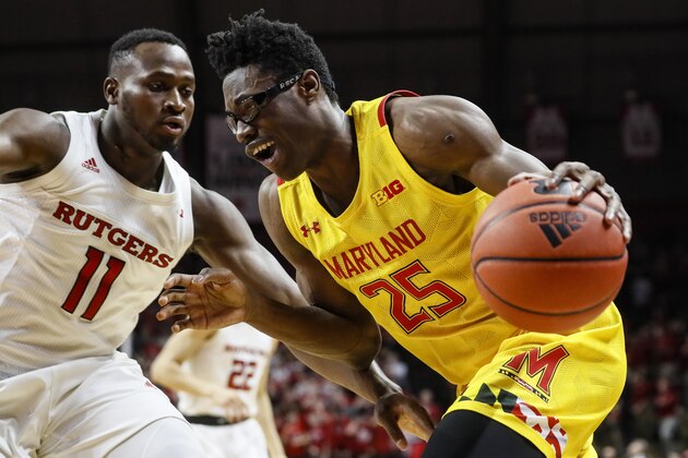 Maryland's Jalen Smith (25) drives against Rutgers' Mamadou Doucoure (11) during the first half of an NCAA college basketball game Tuesday, March 3, 2020, in Piscataway, N.J. (AP Photo/John Minchillo)