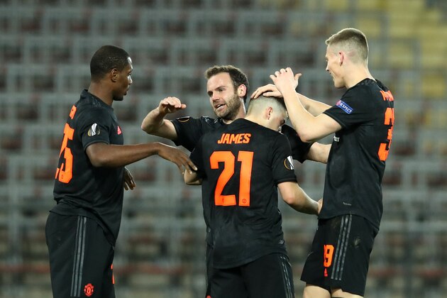 LINZ, AUSTRIA - MARCH 12: (FREE FOR EDITORIAL USE) In this handout image provided by UEFA, Daniel James of Manchester United celebrates with Odion Ighalo, Juan Mata and Scott McTominay after scoring his team's second goal during the UEFA Europa League round of 16 first leg match between LASK and Manchester United at Linzer Stadion on March 12, 2020 in Linz, Austria. The match is played behind closed doors as a precaution against the spread of COVID-19 (Coronavirus).  (Photo by UEFA - Handout/UEFA via Getty Images )