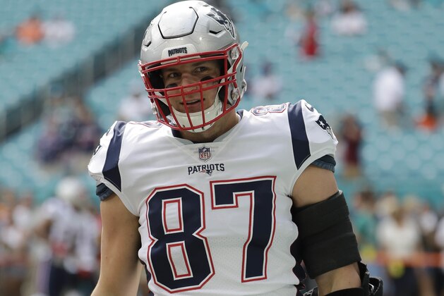 New England Patriots tight end Rob Gronkowski (87) warms up, before an NFL football game against the Miami Dolphins, Sunday, Dec. 9, 2018, in Miami Gardens, Fla. (AP Photo/Lynne Sladky)