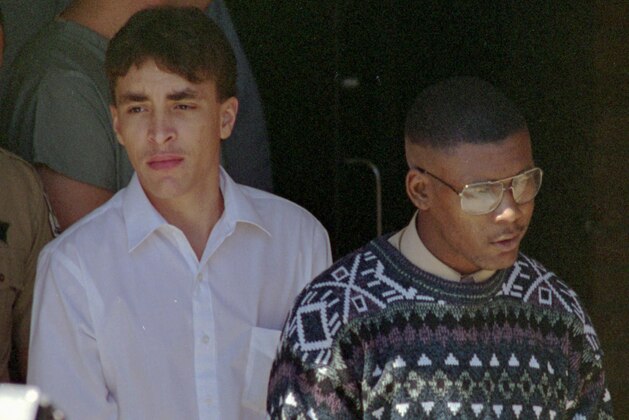 FILE - In a Tuesday Oct. 5, 1993 photo, Larry Demery, left, and Daniel Green, charged with murdering James Jordan, father of NBA star Michael Jordan, leave the courthouse in Lumberton, N.C., after a hearing. Green's case is one of 190 investigations mishandled by the state's crime lab over a 16-year period, according to an outside report released Wednesday, Aug. 18, 2010 that led state prosecutors to request a more detailed review of all the cases.   (AP Photo/Jim Bounds, File)