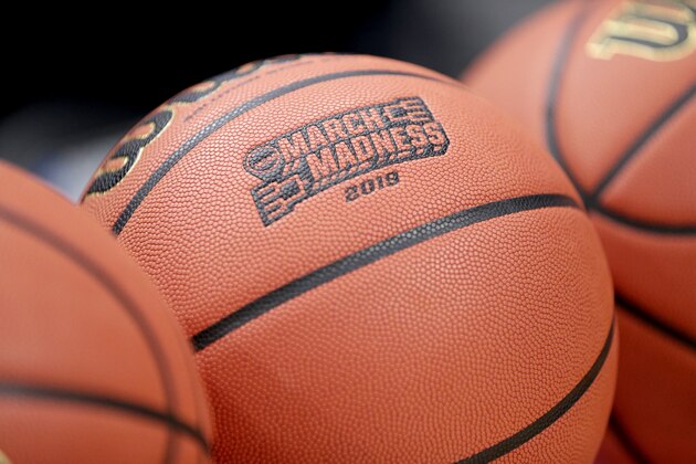FILE - This Wednesday, March 20, 2019, file photo shows a basketball with March Madness 2019 in a rack before Michigan practice at the NCAA college basketball tournament in Des Moines, Iowa. An Ohio man has made history with a March Madness bracket that's perfect through 48 games on the NCAA.com's