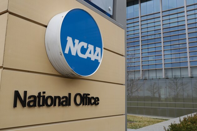 The national office of the NCAA in Indianapolis is shown Thursday, March 12, 2020. The major conferences in college sports have canceled their basketball tournaments because of the new coronavirus, putting the celebrated NCAA college basketball tournament in doubt. (AP Photo/Michael Conroy)