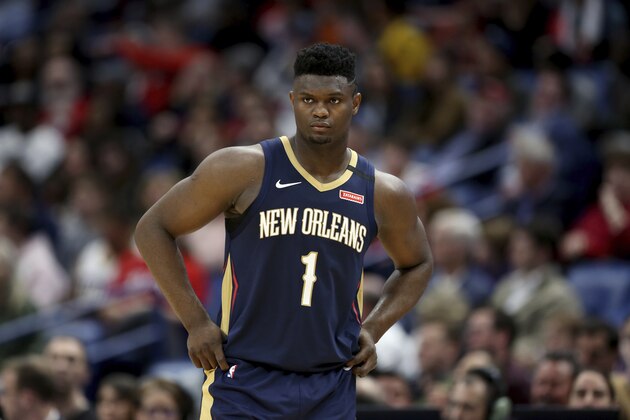 New Orleans Pelicans forward Zion Williamson walks onto the court during the second half of the team's NBA basketball game against the Miami Heat in New Orleans, Friday, March 6, 2020. (AP Photo/Rusty Costanza)
