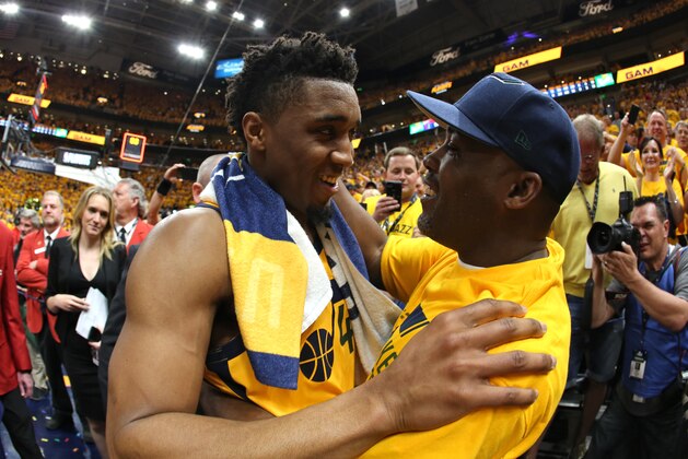 SALT LAKE CITY, UT - APRIL 27:  Donovan Mitchell #45 of the Utah Jazz hugs his father Donovan Mitchell Sr. after in Game Six of the Western Conference Quarterfinals during the 2018 NBA Playoffs against the Oklahoma City Thunder on April 27, 2018 at vivint.SmartHome Arena in Salt Lake City, Utah. NOTE TO USER: User expressly acknowledges and agrees that, by downloading and or using this Photograph, User is consenting to the terms and conditions of the Getty Images License Agreement. Mandatory Copyright Notice: Copyright 2018 NBAE (Photo by Melissa Majchrzak/NBAE via Getty Images)