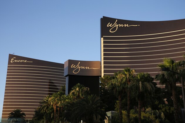 FILE - This June 17, 2014, file photo shows the Wynn Las Vegas and Encore resorts in Las Vegas. The corporate owner of the Wynn and Encore resorts on the Las Vegas Strip is accusing a company building a $4 billion casino across the street of copying its building design. Wynn Resorts Holdings has filed a federal trademark infringement lawsuit alleging that Resorts World Las Vegas wants to mislead the public into believing that its new 3,000-room project is affiliated with Wynn. (AP Photo/John Locher, File)