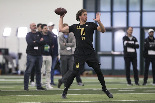 Quarterback Justin Herbert works out during Oregon football pro day in Eugene, Ore., Thursday, March 12, 2020. (AP Photo/Collin Andrew)