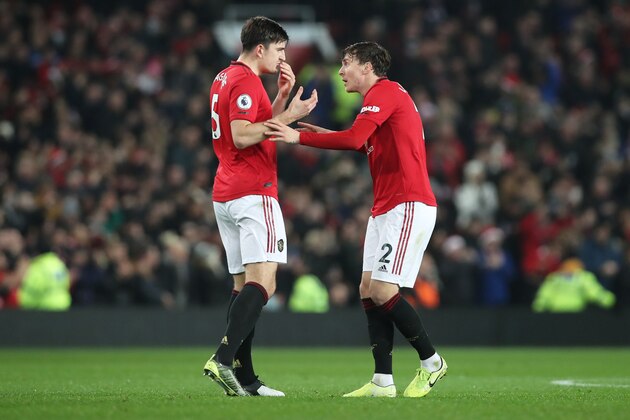 MANCHESTER, ENGLAND - DECEMBER 26: Victor Lindelof of Manchester United speaks with Harry Maguire of Manchester United during the Premier League match between Manchester United and Newcastle United at Old Trafford on December 26, 2019 in Manchester, United Kingdom. (Photo by Ian MacNicol/Getty Images)