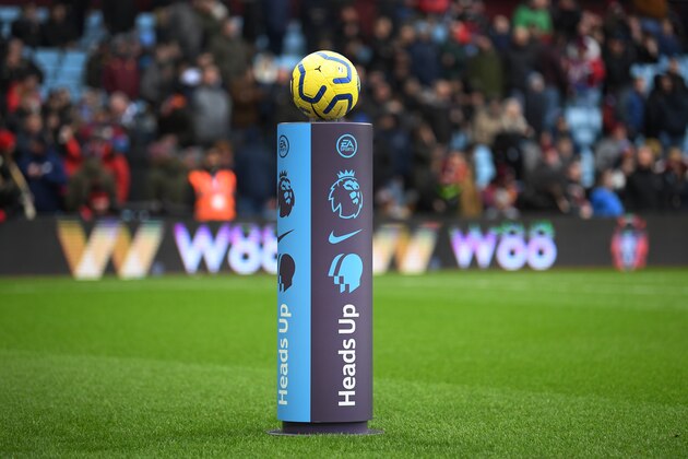 BIRMINGHAM, ENGLAND - FEBRUARY 16: Referee Martin Atkinson takes the match ball from a 'Heads Up' branded plinth during the Premier League match between Aston Villa and Tottenham Hotspur at Villa Park on February 16, 2020 in Birmingham, United Kingdom. (Photo by Michael Regan/Getty Images)