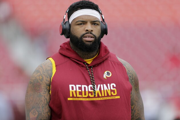 Washington Redskins' Trent Williams walks onto the field prior to a preseason NFL football game between the Cincinnati Bengals and Washington Redskins, Sunday, Aug. 27, 2017, in Landover, Md. (AP Photo/Mark Tenally)