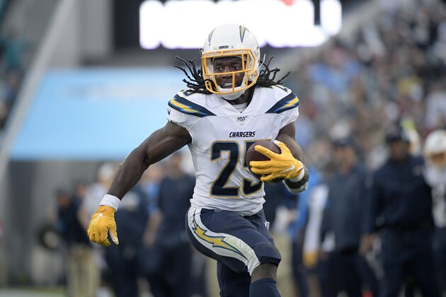 Los Angeles Chargers running back Melvin Gordon (25) runs after catching a pass during the first half of an NFL football game against the Jacksonville Jaguars Sunday, Dec. 8, 2019, in Jacksonville, Fla. (AP Photo/Phelan M. Ebenhack)