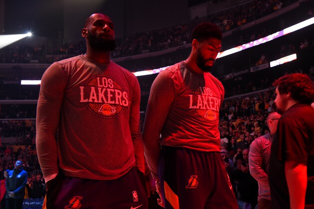 LOS ANGELES, CA - MARCH 10: LeBron James #23, and Anthony Davis #3 of the Los Angeles Lakers stands for the National Anthem before the game against the Brooklyn Nets on March 10, 2020 at STAPLES Center in Los Angeles, California. NOTE TO USER: User expressly acknowledges and agrees that, by downloading and/or using this Photograph, user is consenting to the terms and conditions of the Getty Images License Agreement. Mandatory Copyright Notice: Copyright 2020 NBAE (Photo by Andrew D. Bernstein/NBAE via Getty Images)