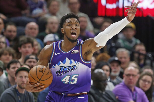 Utah Jazz guard Donovan Mitchell gestures to teammates during the first half of the team's NBA basketball game against the Boston Celtics on Wednesday, Feb. 26, 2020, in Salt Lake City. (AP Photo/Rick Bowmer)