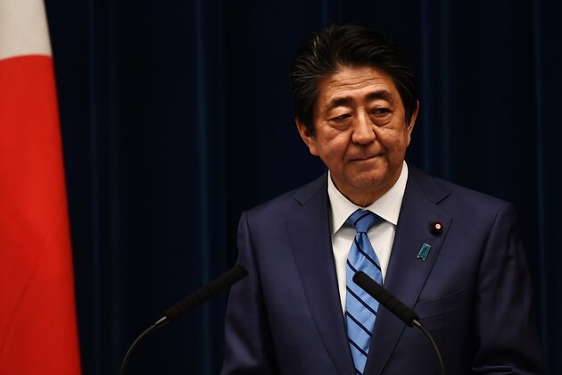 Japanese Prime Minister Shinzo Abe arrives to talk to the media during a press conference in Tokyo on March 14, 2020. (Photo by CHARLY TRIBALLEAU / AFP) (Photo by CHARLY TRIBALLEAU/AFP via Getty Images)