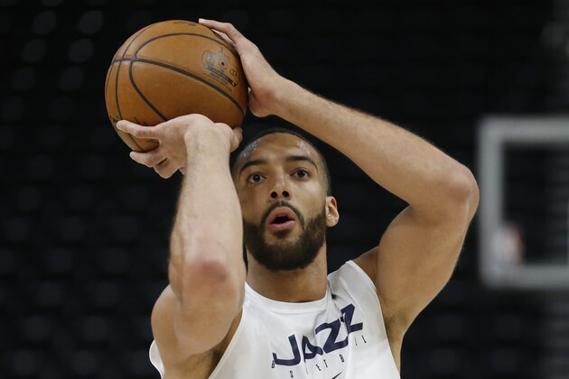 Utah Jazz center Rudy Gobert shoots during practice before the start of their NBA basketball game against the Phoenix Suns Monday, Feb. 24, 2020, in Salt Lake City. (AP Photo/Rick Bowmer)