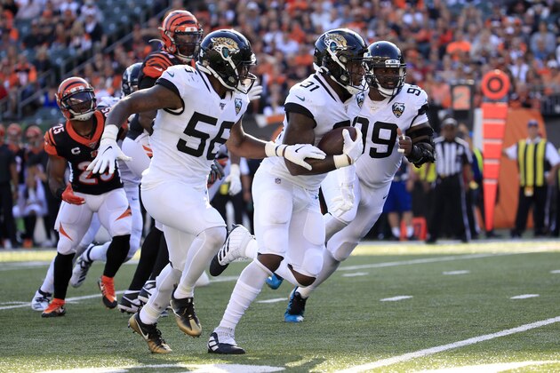 CINCINNATI, OHIO - OCTOBER 20:   Yannick Ngakoue #91 of the Jacksonville Jaguars returns an interception for a touchdown against the Cincinnati Bengals at Paul Brown Stadium on October 20, 2019 in Cincinnati, Ohio. (Photo by Andy Lyons/Getty Images)