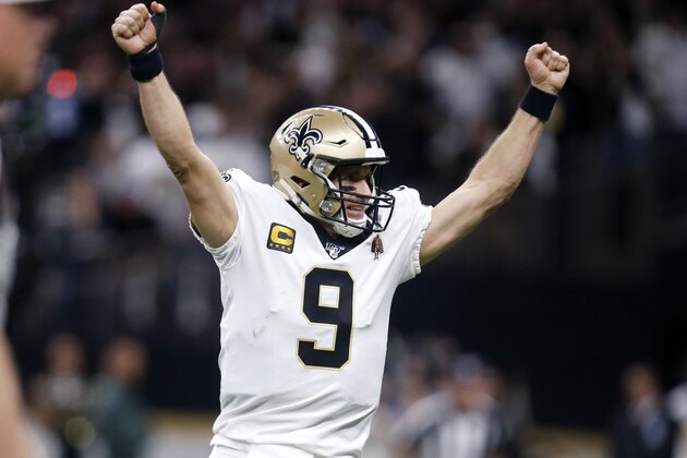 New Orleans Saints quarterback Drew Brees (9) celebrates a touchdown carry by Alvin Kamara in the first half of an NFL wild-card playoff football game against the Minnesota Vikings, Sunday, Jan. 5, 2020, in New Orleans. (AP Photo/Butch Dill)