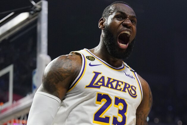 Los Angeles Lakers forward LeBron James celebrates after scoring and drawing a foul during the second half of an NBA basketball game against the Los Angeles Sunday, March 8, 2020, in Los Angeles. The Lakers won 112-103. (AP Photo/Mark J. Terrill)