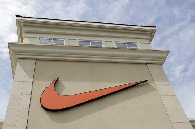 A Nike logo is displayed outside a Nike store in Charlotte, N.C., Tuesday, Sept. 4, 2018. Colin Kaepernick has a new deal with Nike, even without having a job in the NFL. Kaepernick's attorney, Mark Geragos, made the announcement on Twitter, calling the former San Francisco 49ers quarterback an